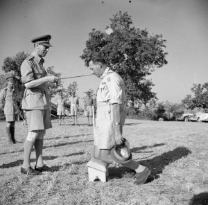 George_VI_knighting_General_Leese_Jul_1944